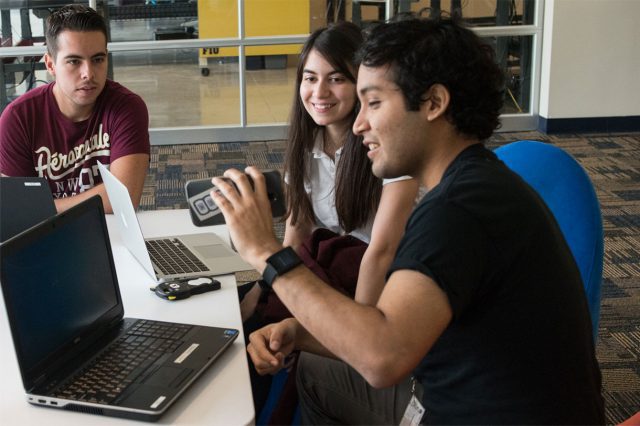 FIU Student demonstrating application on mobile device.