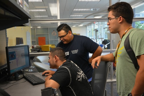SCIS students work with Marino Campus Young adults with developmental disabilities and bond with peers over computers